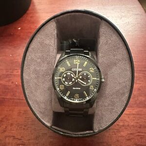 Citizen Black and Gold Timepiece